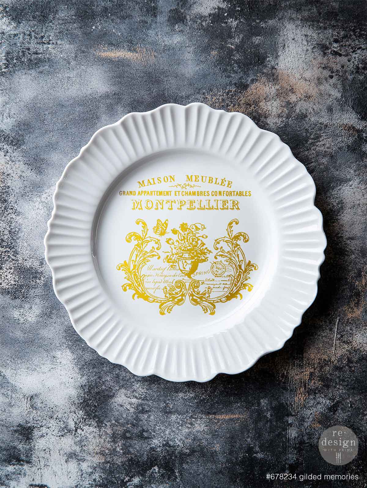 White plate with yellow decorative text and design on a textured gray background